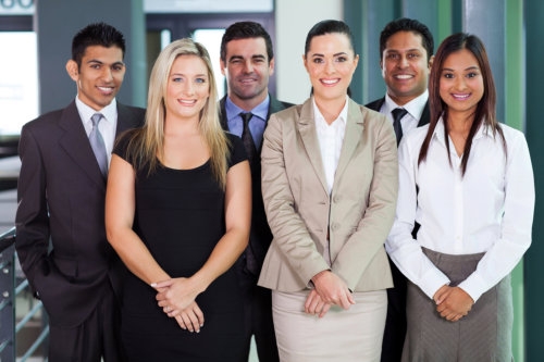 group of young business people standing together in office